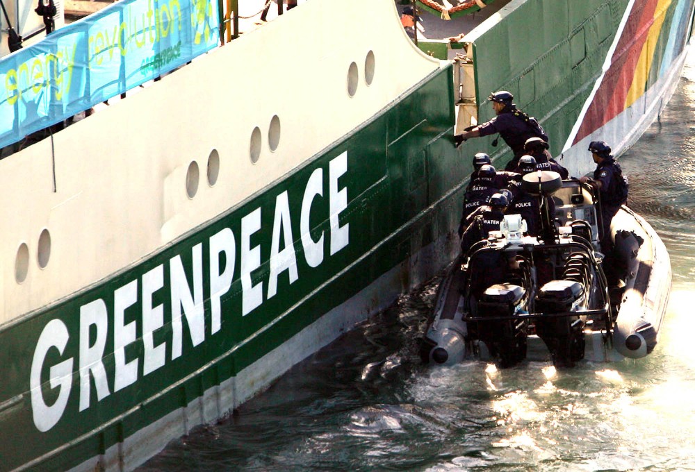 Newcastle, July 27, 2005. Police boarding the Greenpeace ship, Rainbow Warrior in Newcastle today. The skipper of the ship was arrested and later released, charges are pending.